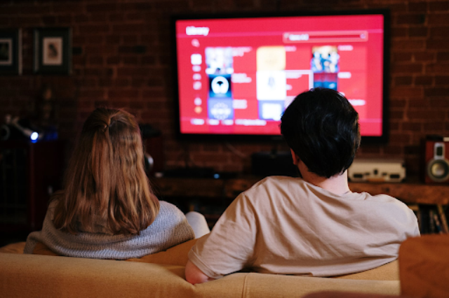 People are more indulged in watching TV as content available online can now be accessed on television. Image by cottonbro, licensed under Pexels.